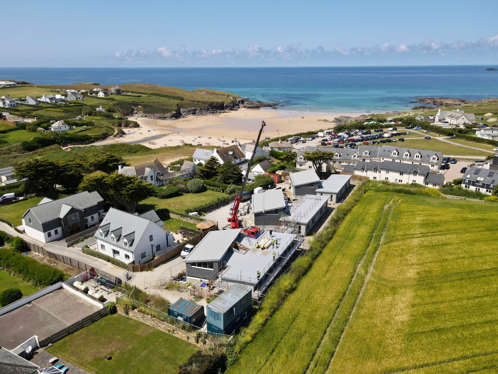 homes by the sea next to green grass