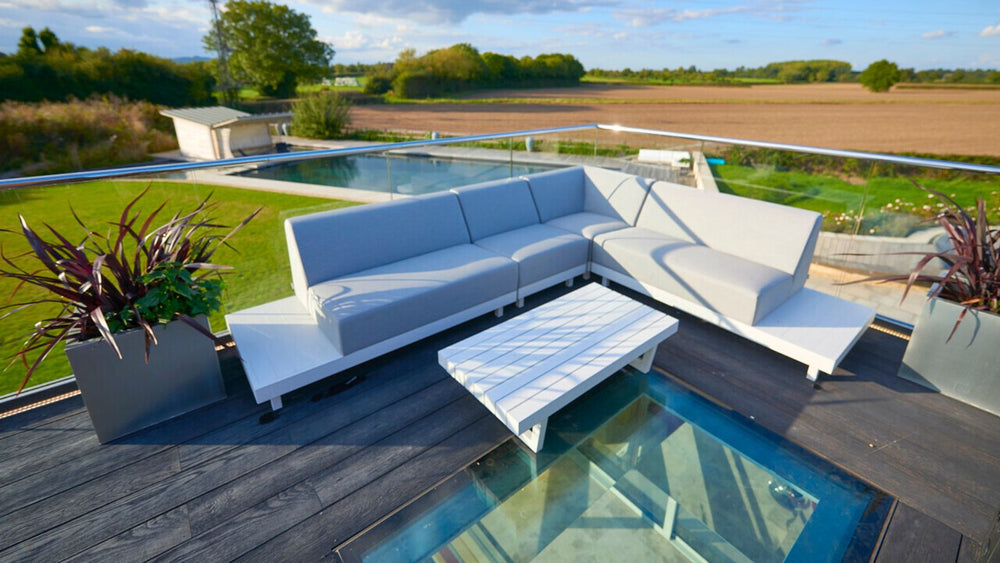 rooflight installed in decking near a white sofa and table on a terrace 